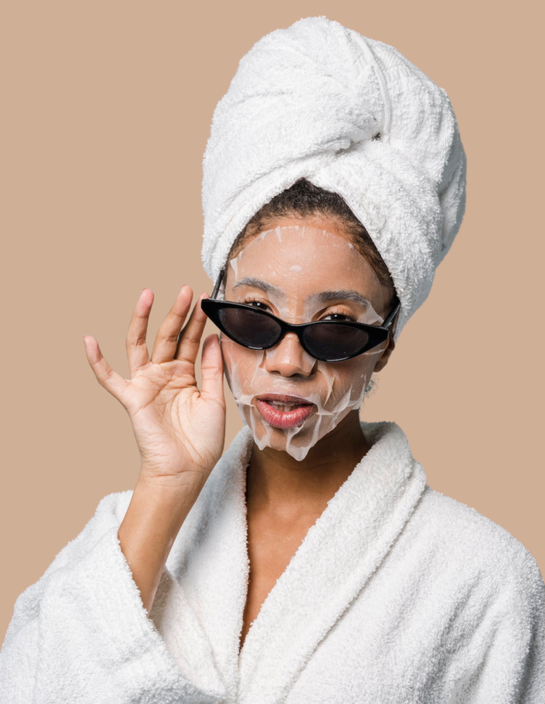 self Confident ethnic woman with sheet mask adjusting sunglasses in brown studio